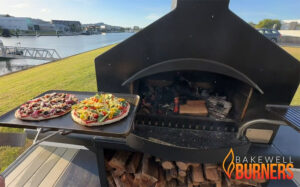 outdoor fireplace being used for cooking pizza